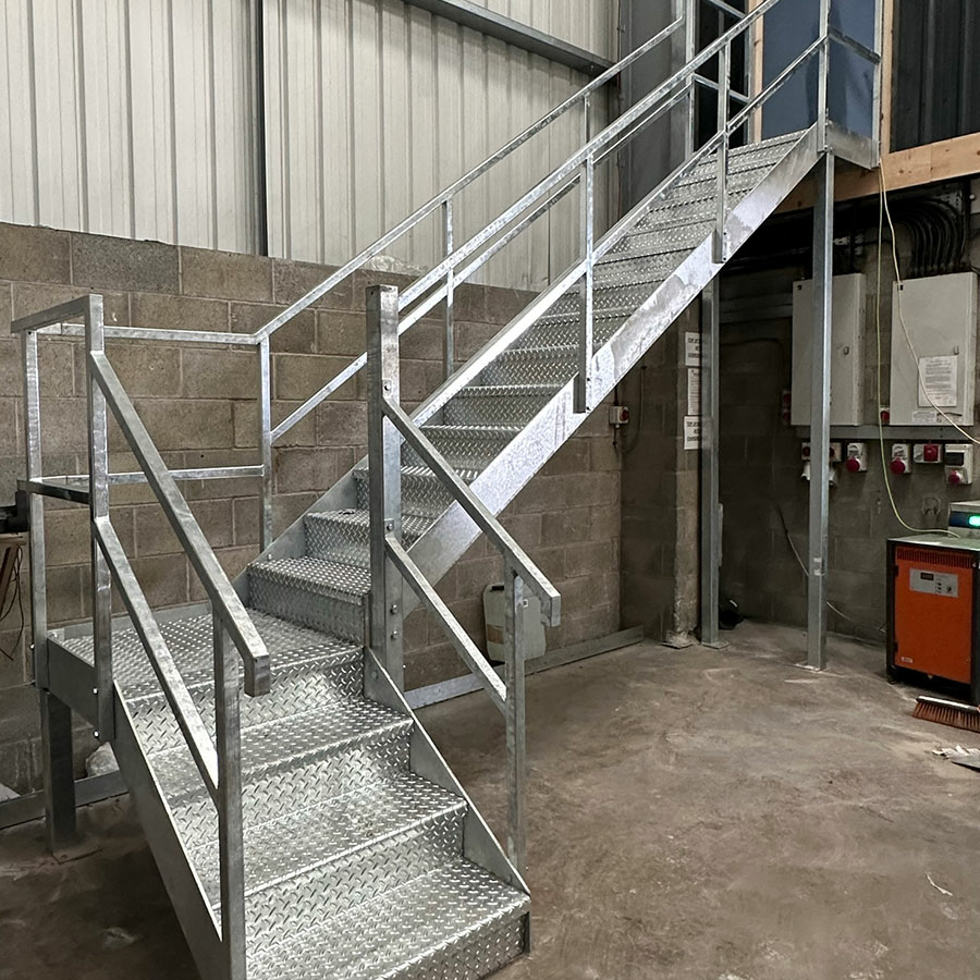 Galvanised metal staircase with railing and banister